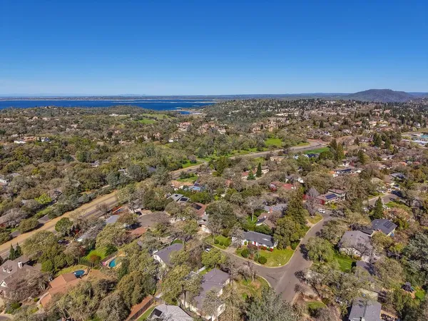 an aerial view of residential houses with outdoor space