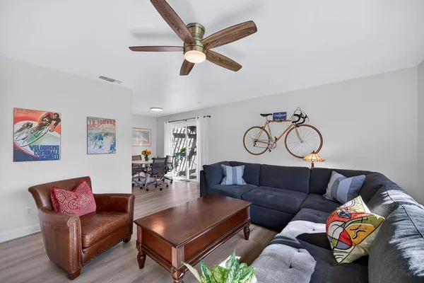 a living room with furniture and a window