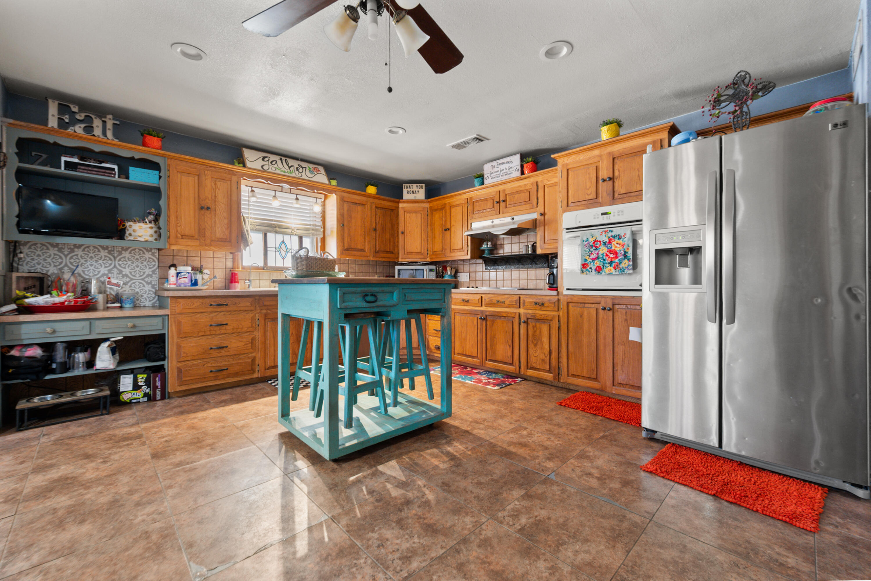 1204 Garland Plainview, TX 79072 - Photo 12 of 29 a kitchen with stainless steel appliances granite countertop a refrigerator and a stove top oven