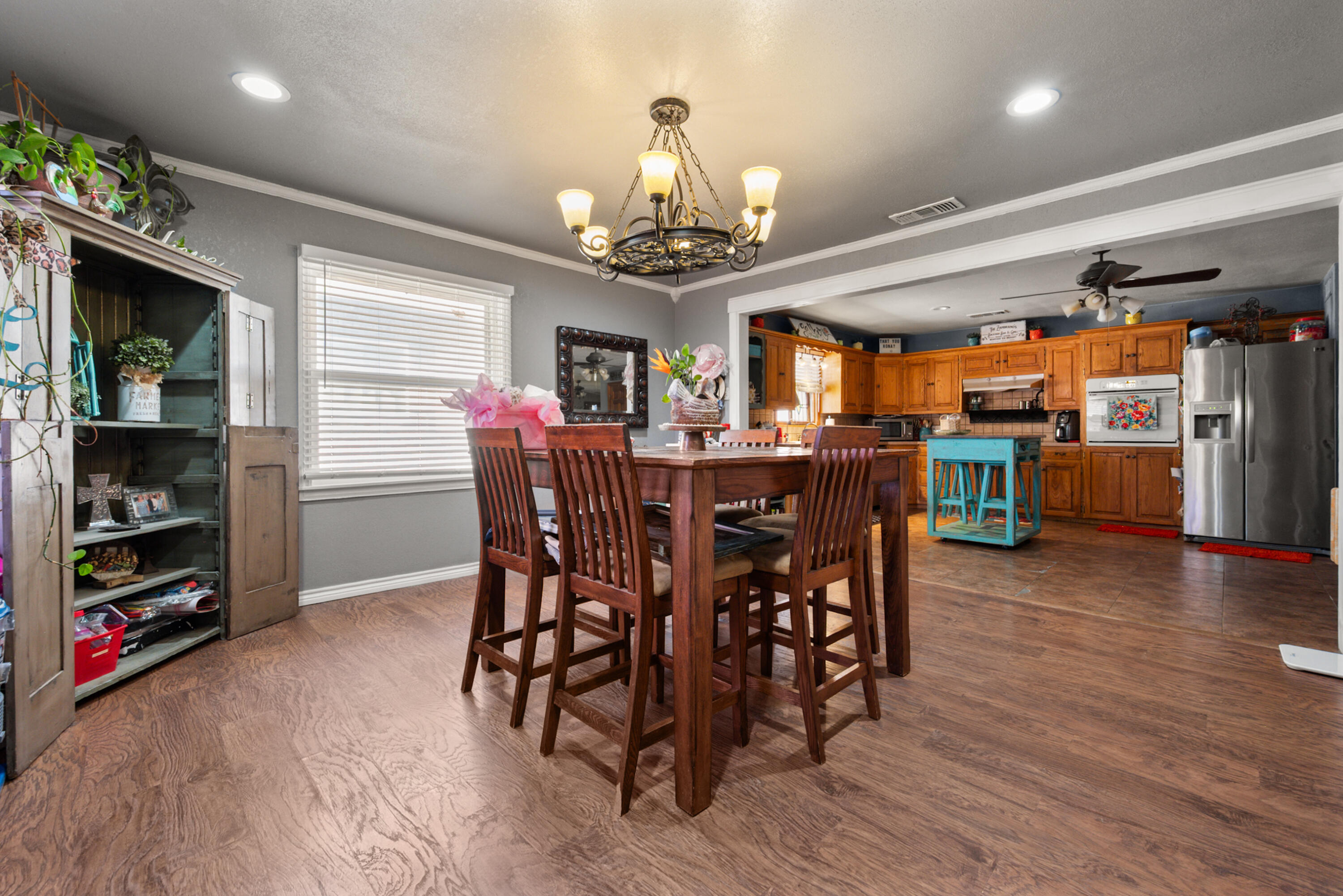 1204 Garland Plainview, TX 79072 - Photo 18 of 29 a view of a dining room with furniture window and wooden floor