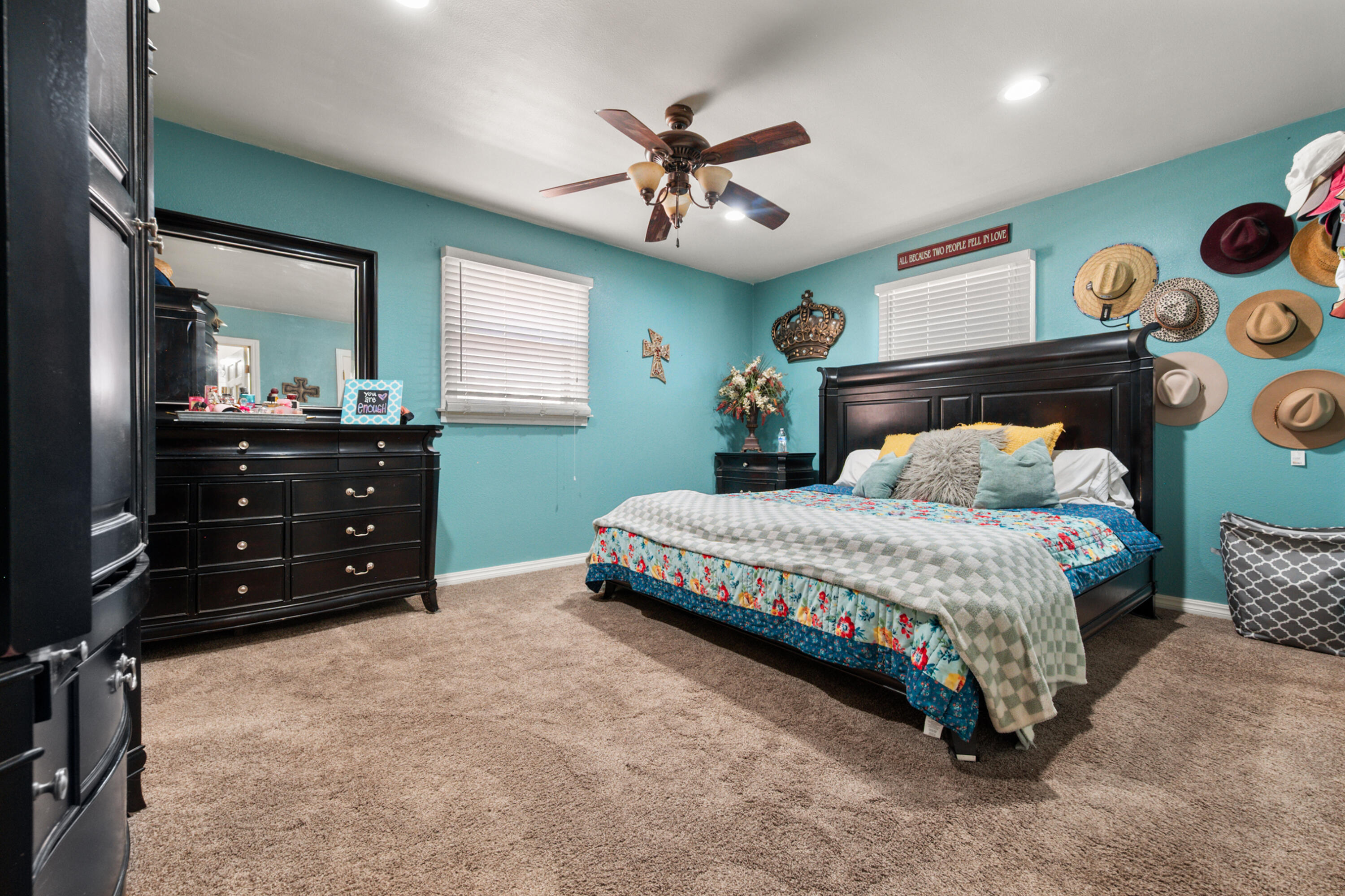 1204 Garland Plainview, TX 79072 - Photo 20 of 29 a bedroom with a bed and a chandelier