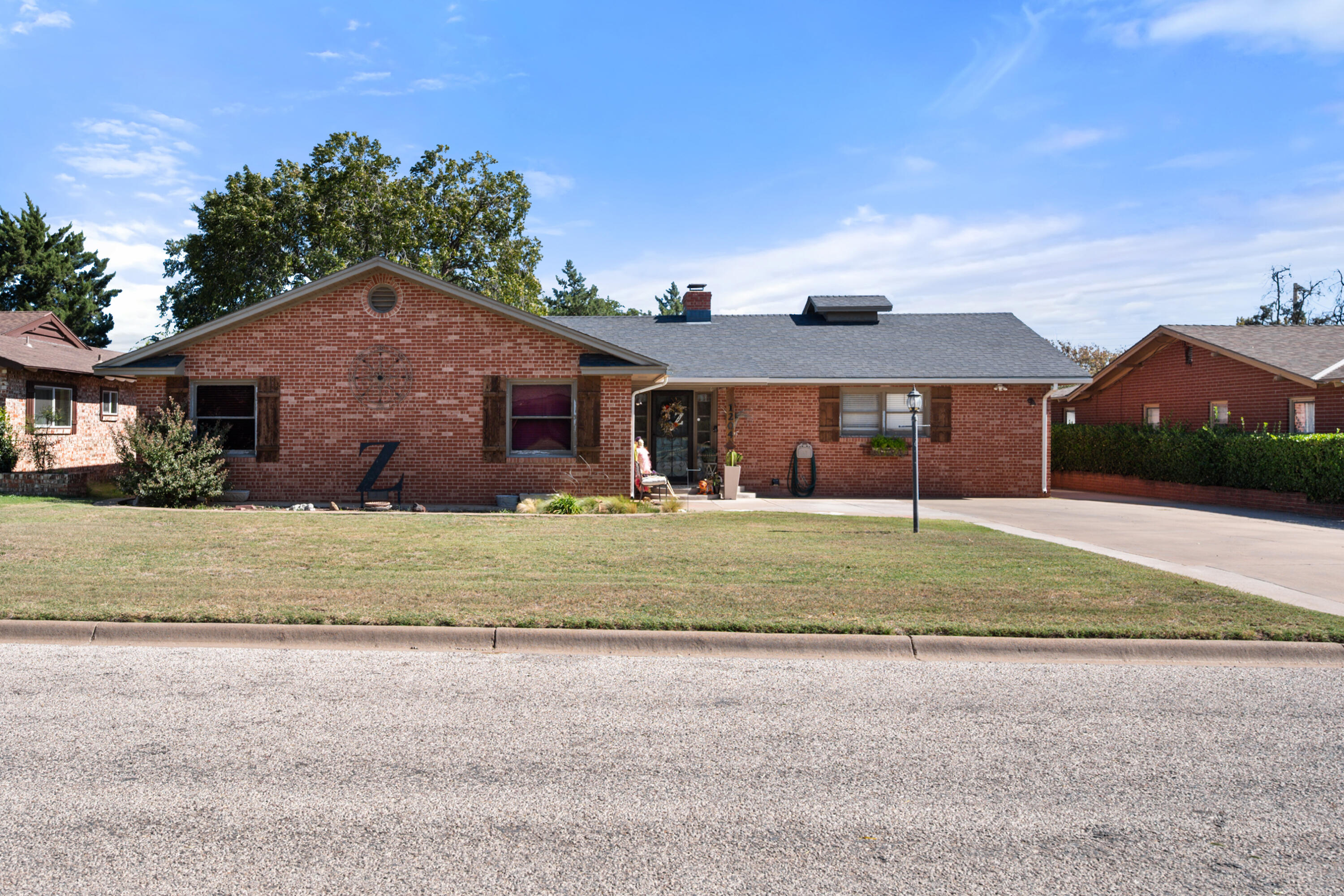 1204 Garland Plainview, TX 79072 - Photo 2 of 29 a front view of a house with a yard