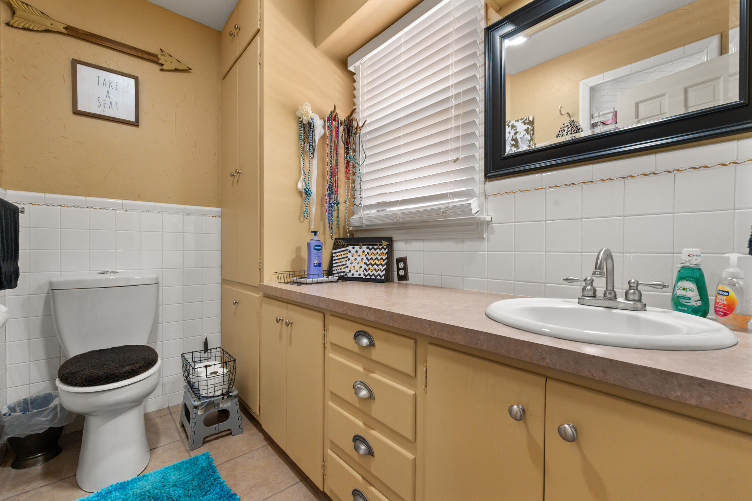1204 Garland Plainview, TX 79072 - Photo 22 of 29 a bathroom with a granite countertop toilet sink and mirror