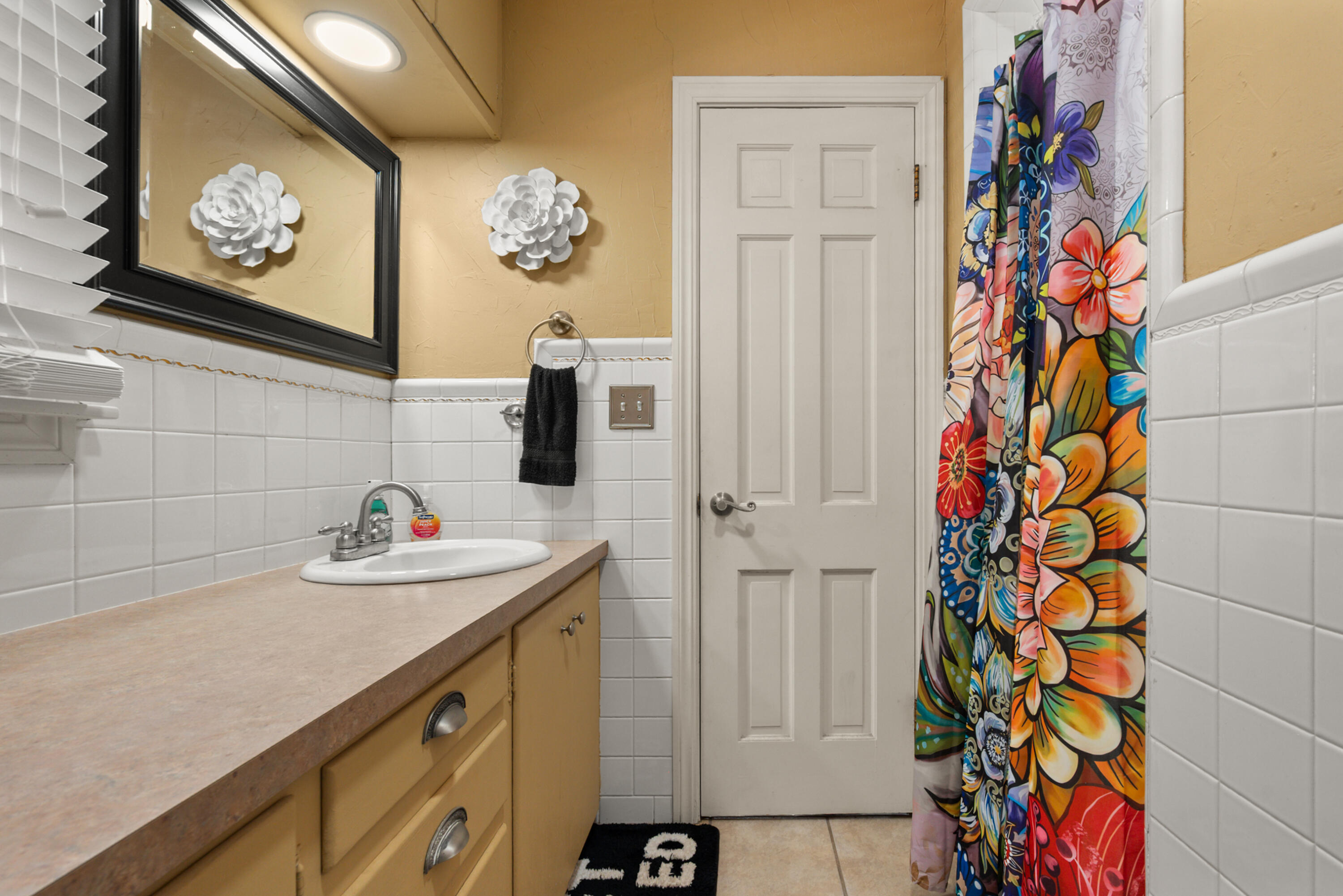 1204 Garland Plainview, TX 79072 - Photo 23 of 29 a bathroom with a sink and a mirror