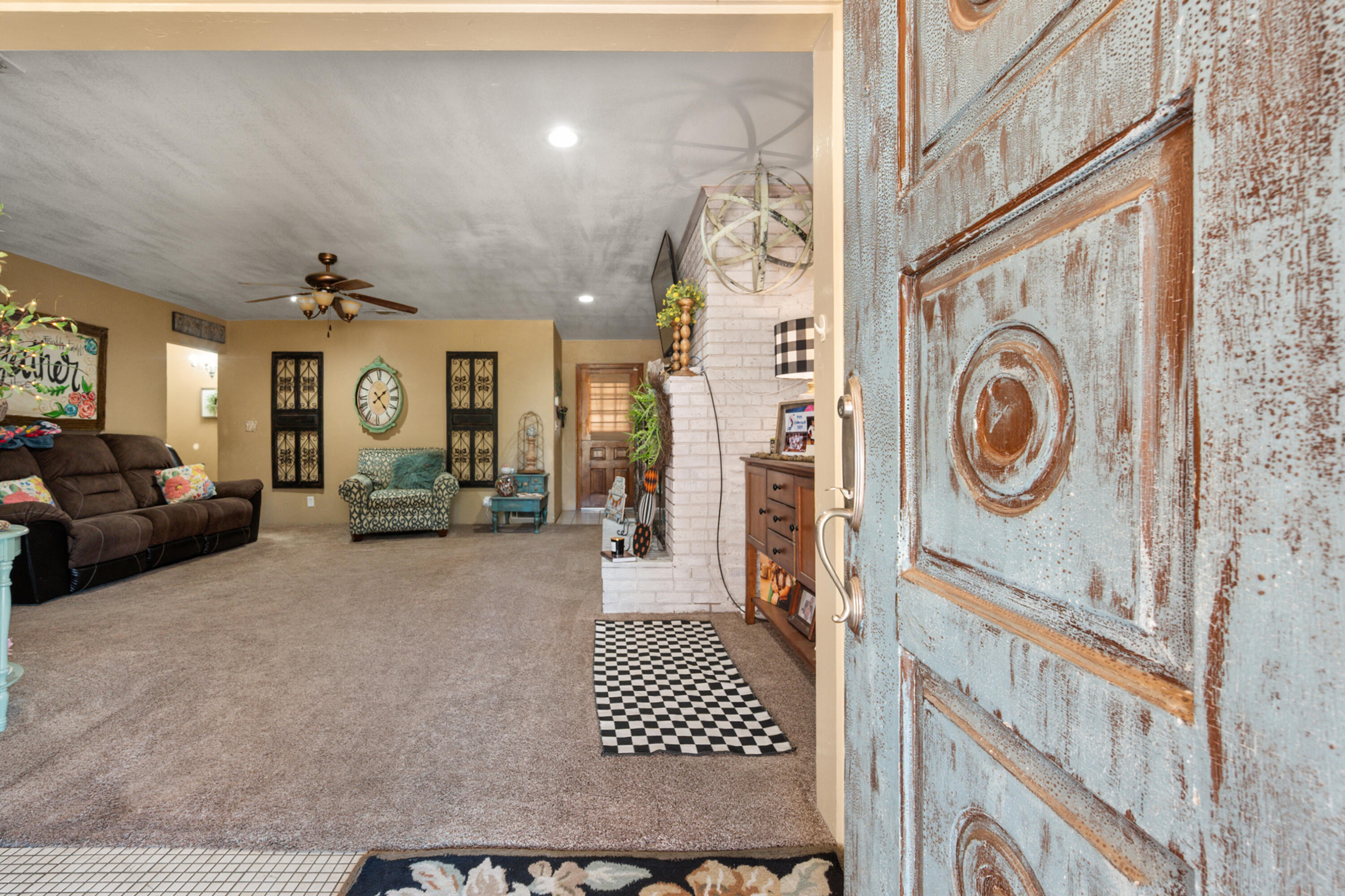 1204 Garland Plainview, TX 79072 - Photo 6 of 29 a view of a hallway with furniture and chandelier
