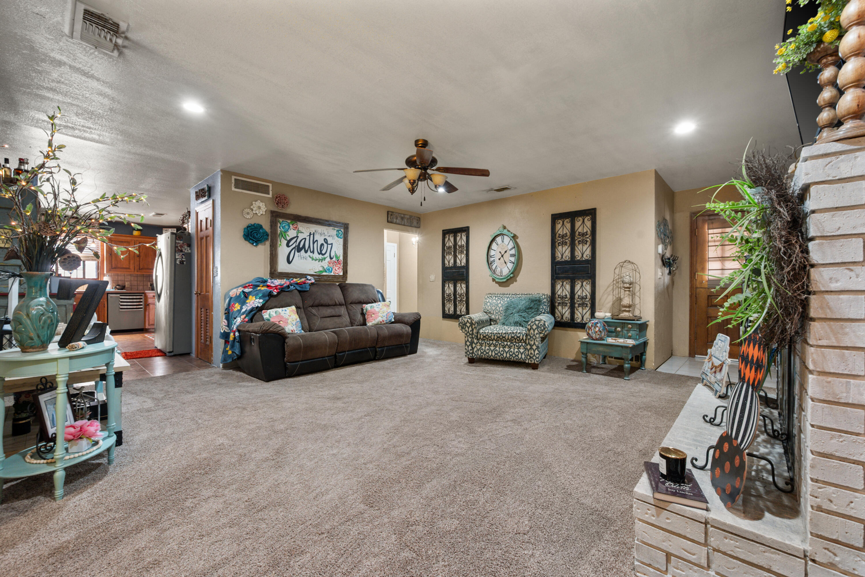 1204 Garland Plainview, TX 79072 - Photo 7 of 29 a living room with furniture a fireplace and a window