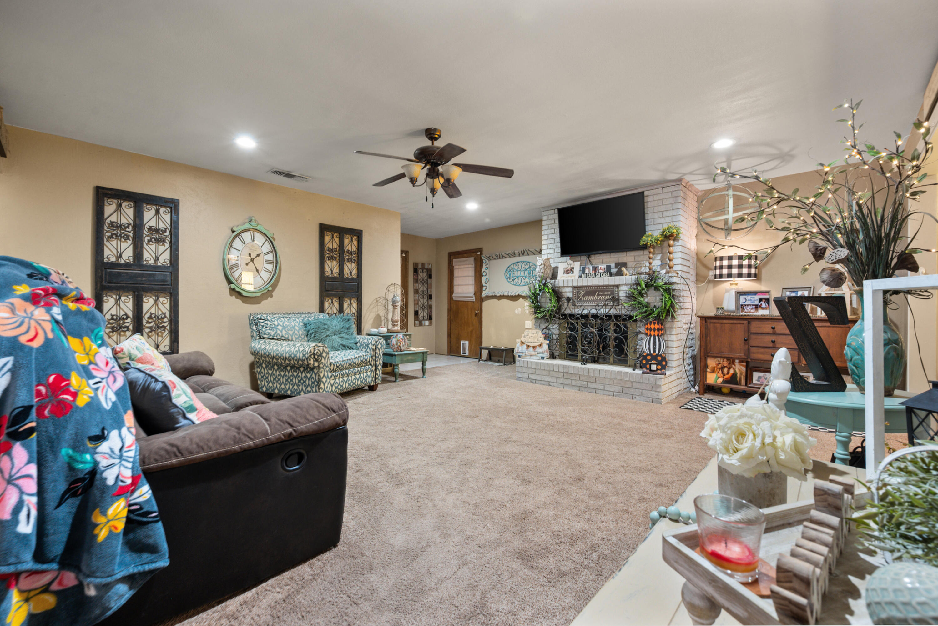 1204 Garland Plainview, TX 79072 - Photo 8 of 29 a living room with furniture and a flat screen tv