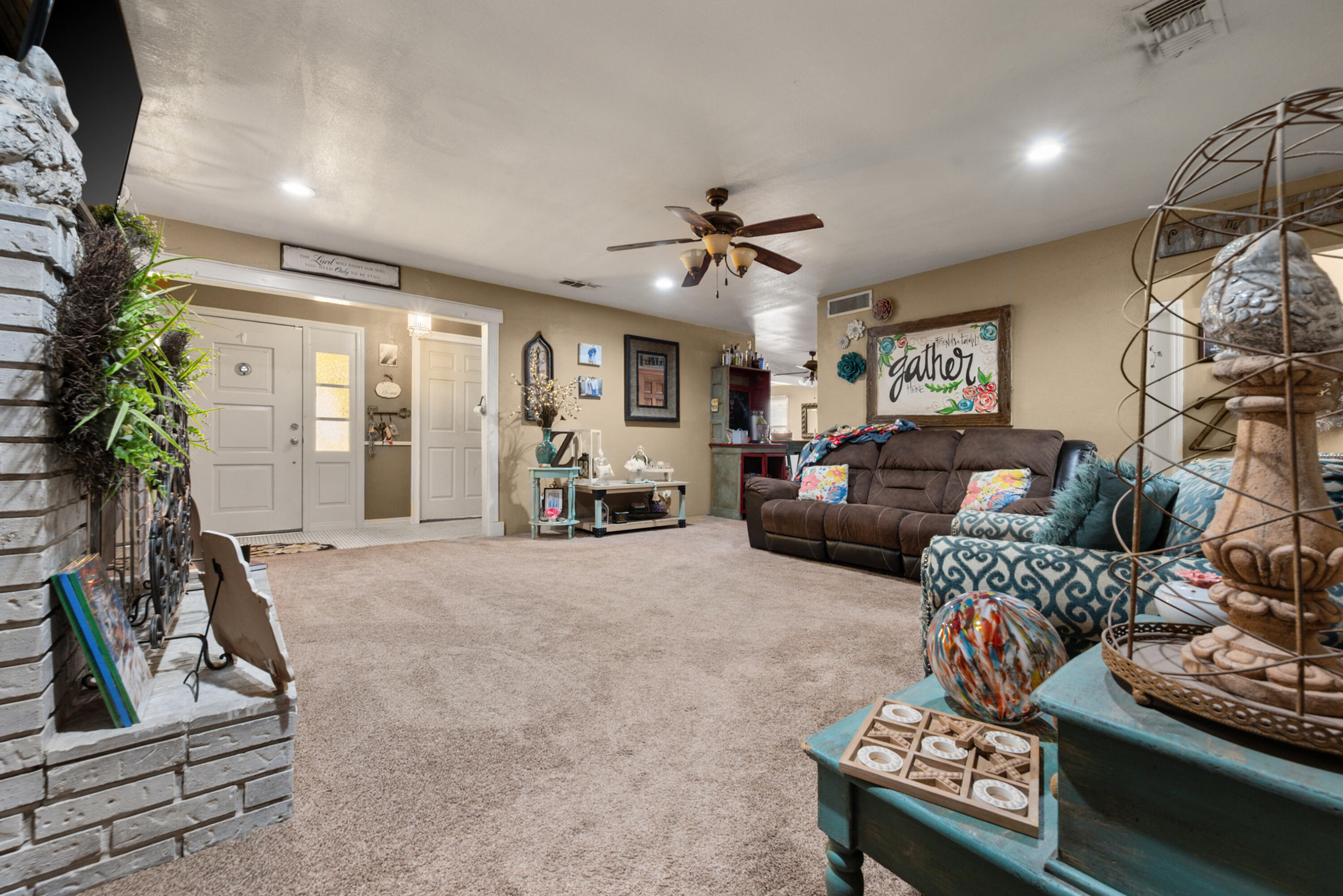 1204 Garland Plainview, TX 79072 - Photo 10 of 29 a living room with furniture a chandelier and a window