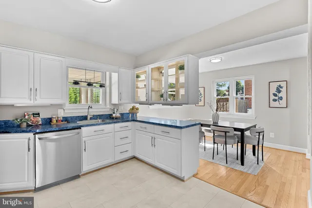 a large kitchen with lots of counter space and windows