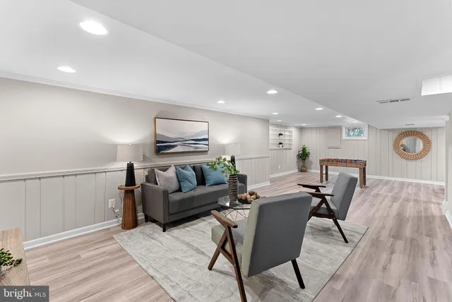 a living room with furniture and a table