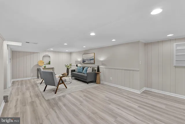 a workspace with furniture window and wooden floor