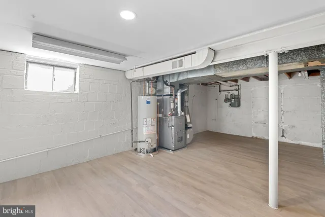 a utility room with cabinets washer and dryer
