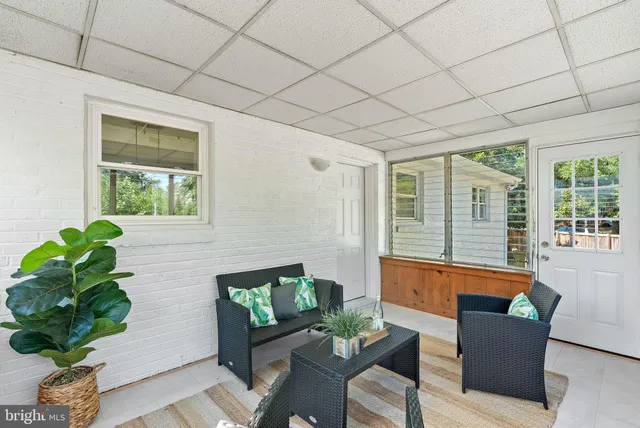 a living room with large windows