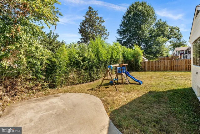 a view of backyard space with cabin