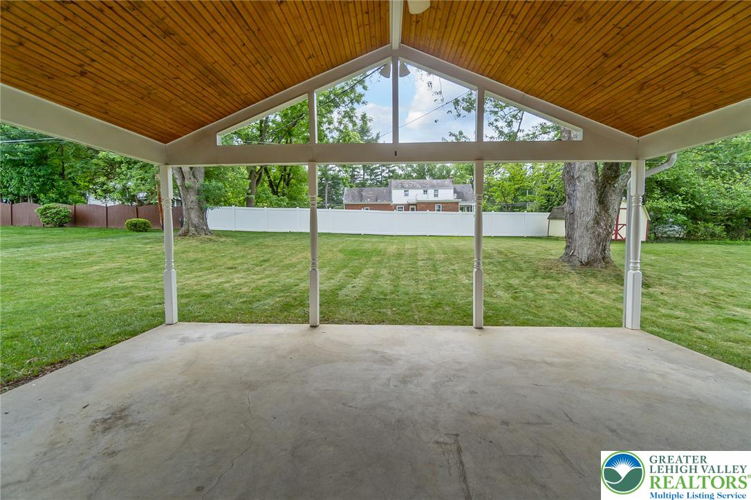 268 Apollo Drive Bethlehem, PA 18017 - Photo 52 of 56 An inviting covered patio, with 2 skylights & ceiling fan is perfect for relaxing with views of the manicured yard and surrounding trees.