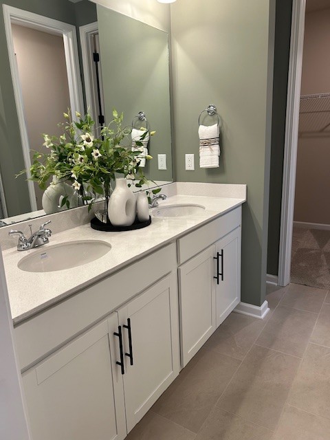 304 Hickory Pointe Drive Dickson, TN 37055 - Photo 22 of 26 a bathroom with a sink and a mirror