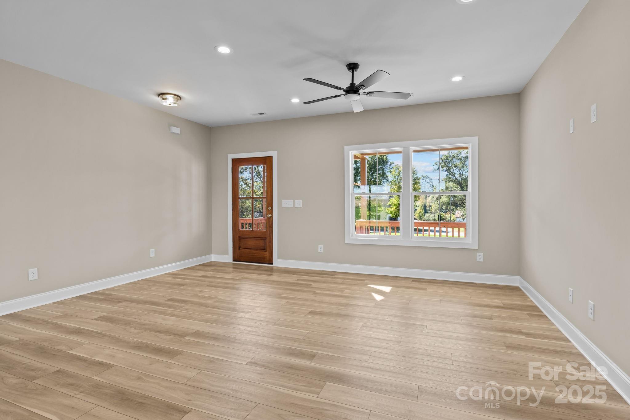 1716 Jennings Road Olin, NC 28660 - Photo 11 of 48 wooden floor in an empty room with a window