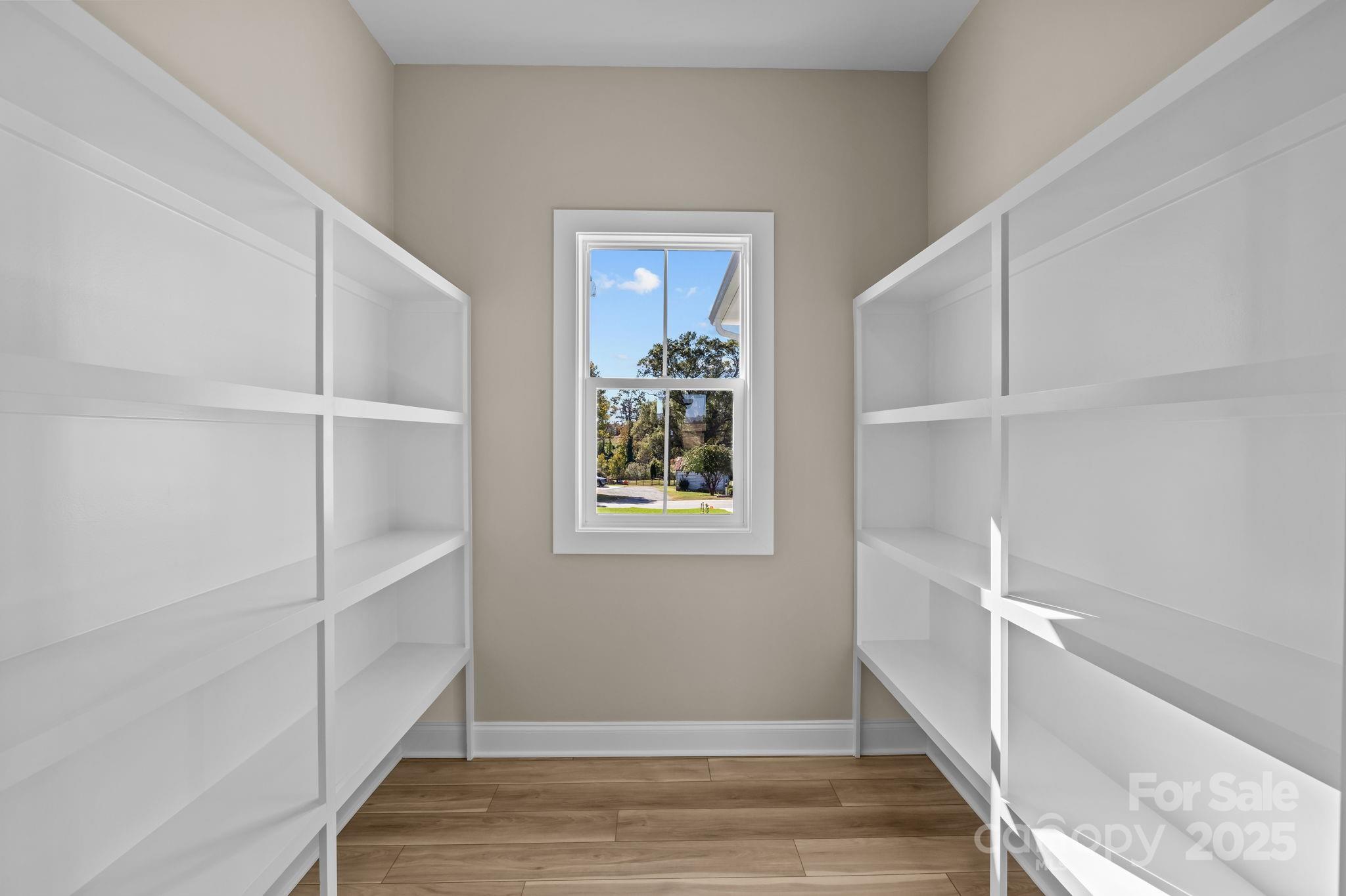 1716 Jennings Road Olin, NC 28660 - Photo 22 of 48 a view of an empty room with wooden floor and closet