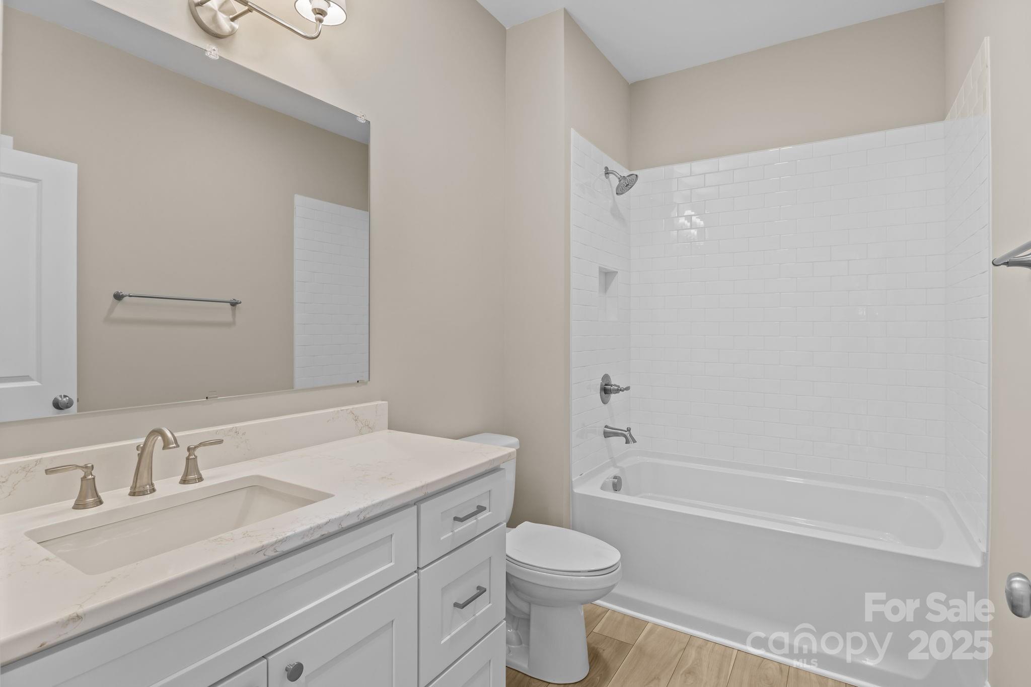 1716 Jennings Road Olin, NC 28660 - Photo 24 of 48 a bathroom with a sink a toilet and a bathtub