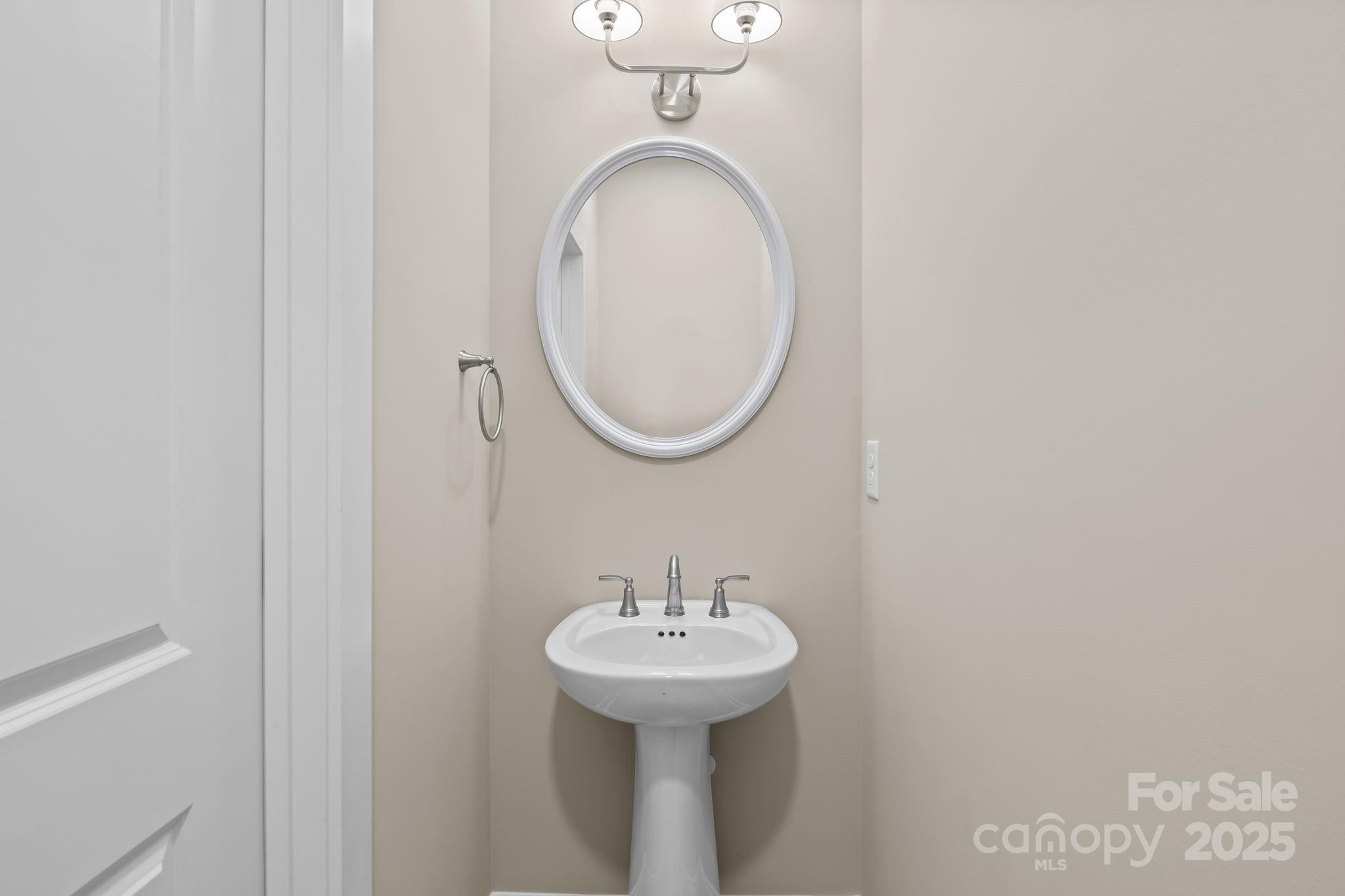 1716 Jennings Road Olin, NC 28660 - Photo 28 of 48 a bathroom with a sink and a mirror