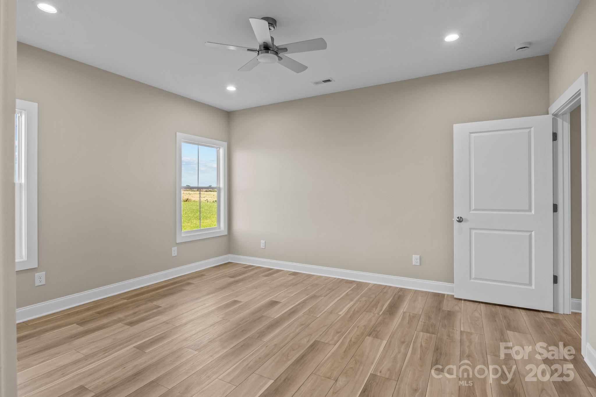 1716 Jennings Road Olin, NC 28660 - Photo 30 of 48 a view of empty room with window and wooden floor