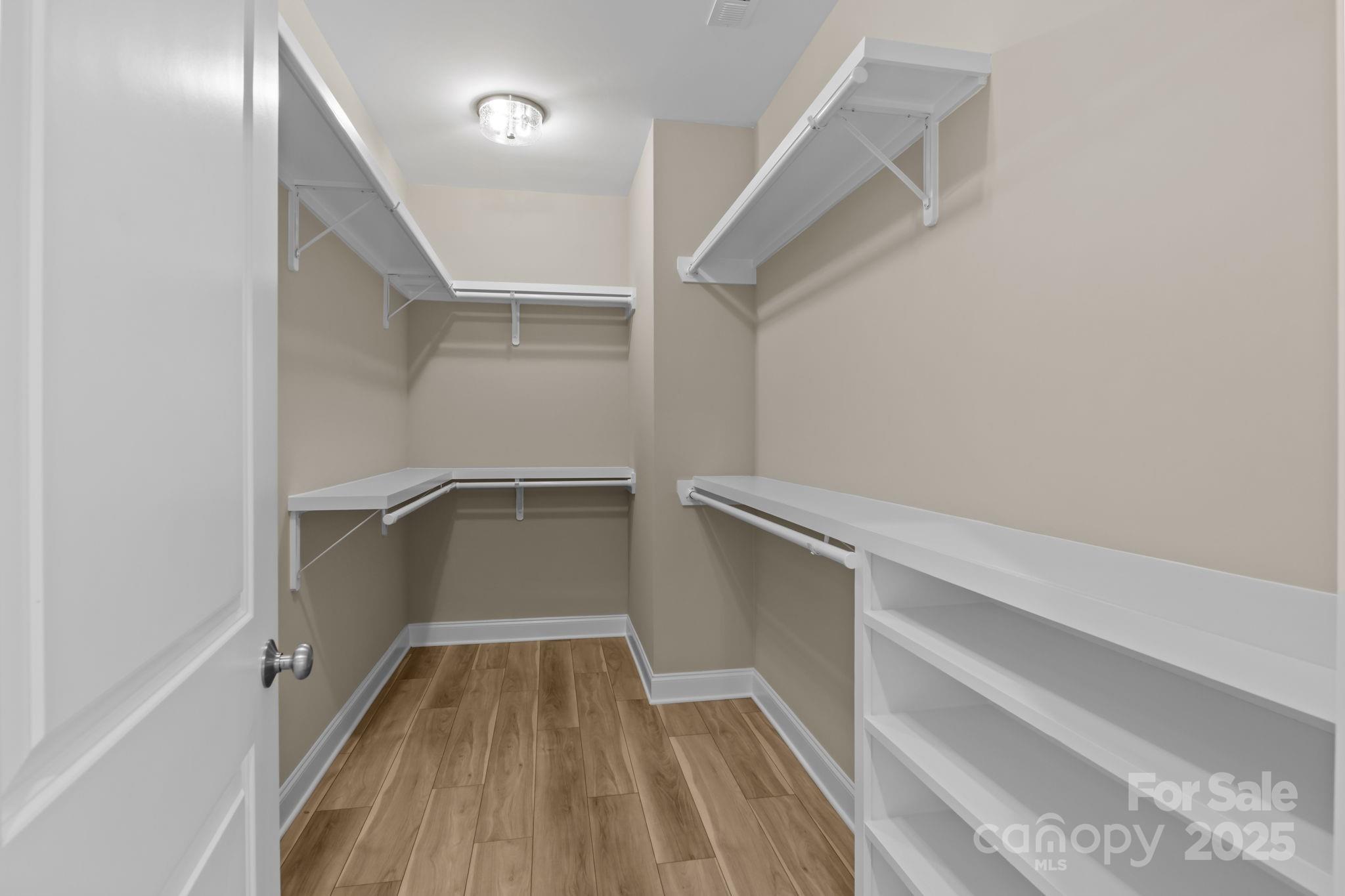 1716 Jennings Road Olin, NC 28660 - Photo 31 of 48 a view of walk in closet with empty racks