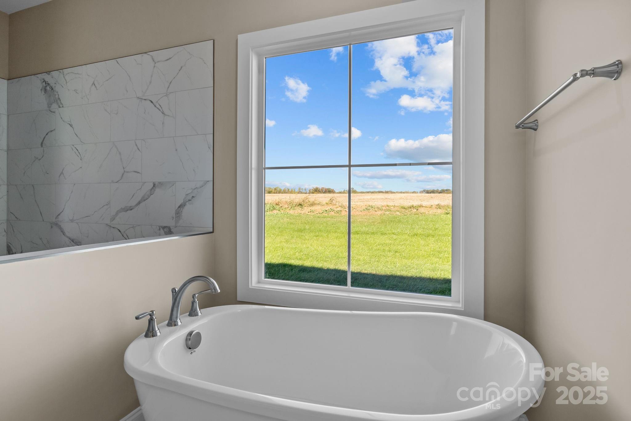 1716 Jennings Road Olin, NC 28660 - Photo 33 of 48 a white bath tub sitting next to a window