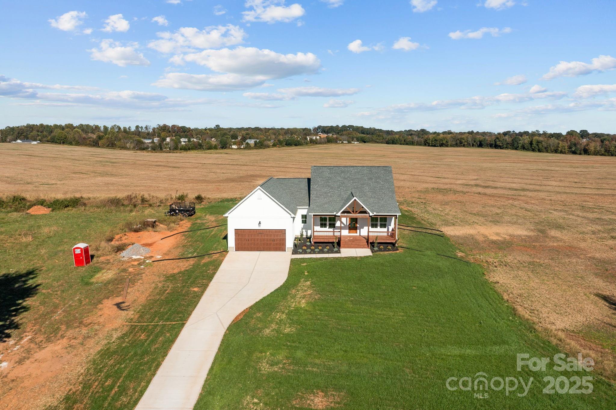 1716 Jennings Road Olin, NC 28660 - Photo 4 of 48 a view of a lake with a garden