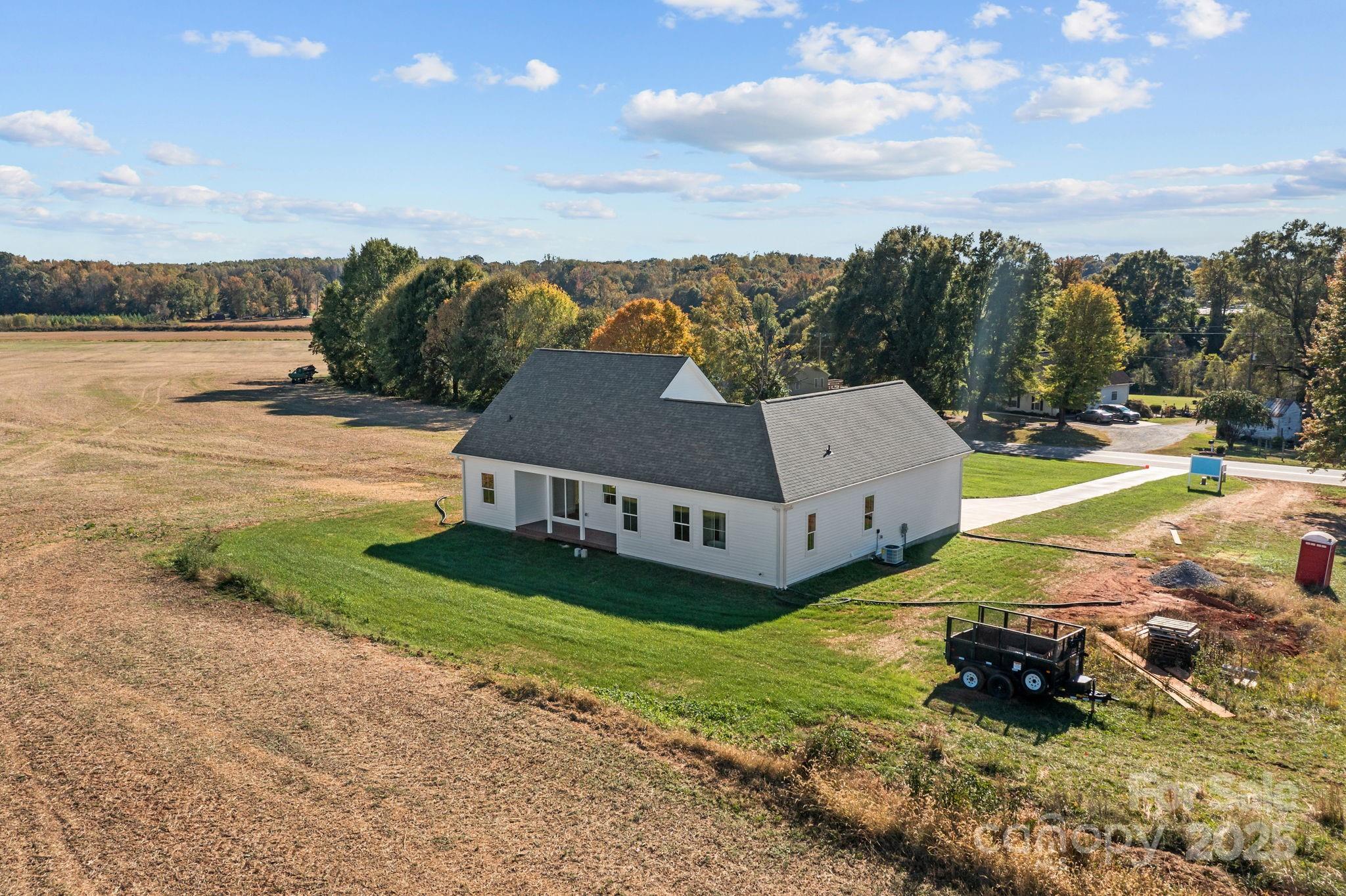 1716 Jennings Road Olin, NC 28660 - Photo 41 of 48 a view of a house with outdoor space and a lake view in back
