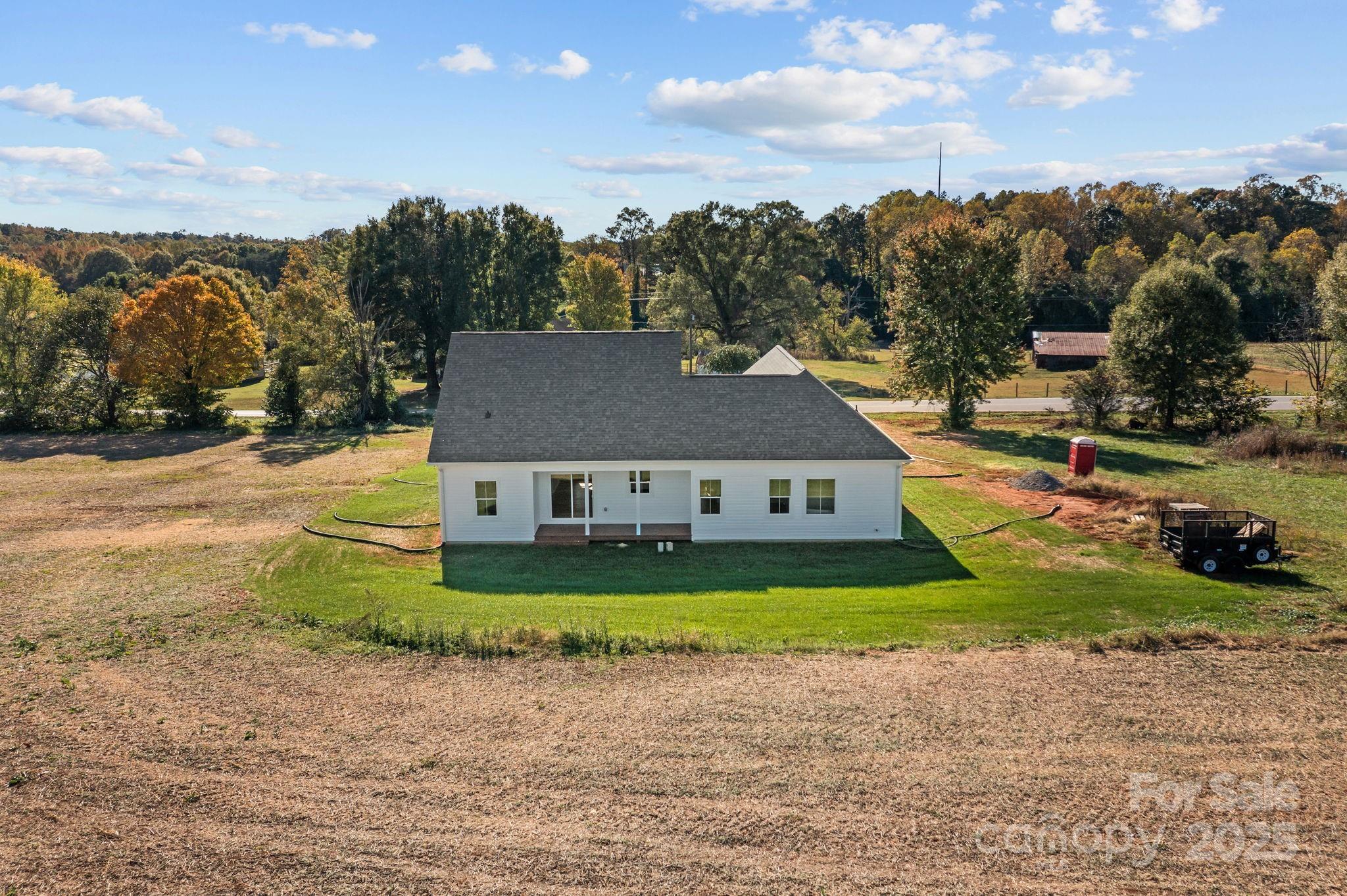 1716 Jennings Road Olin, NC 28660 - Photo 43 of 48 a view of a house with a yard