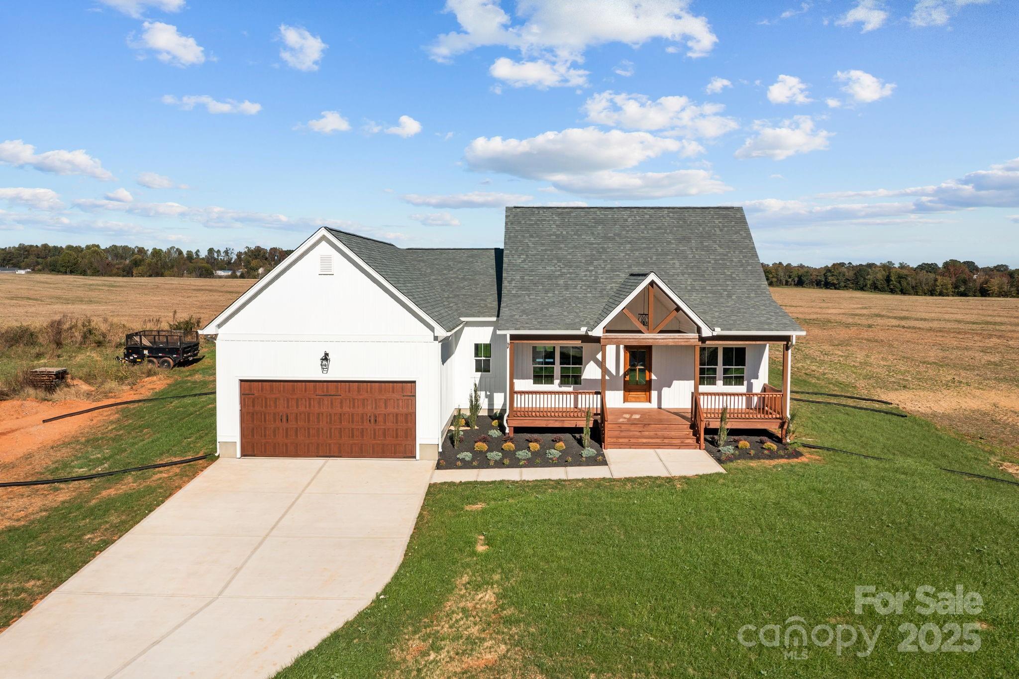 1716 Jennings Road Olin, NC 28660 - Photo 45 of 48 a view of a house with a yard