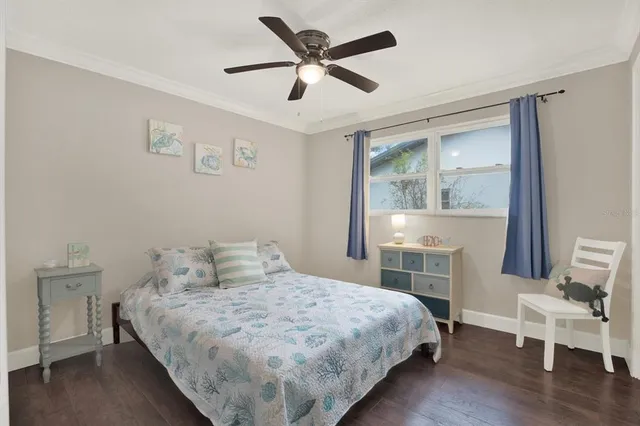 a bedroom with a bed and a chair