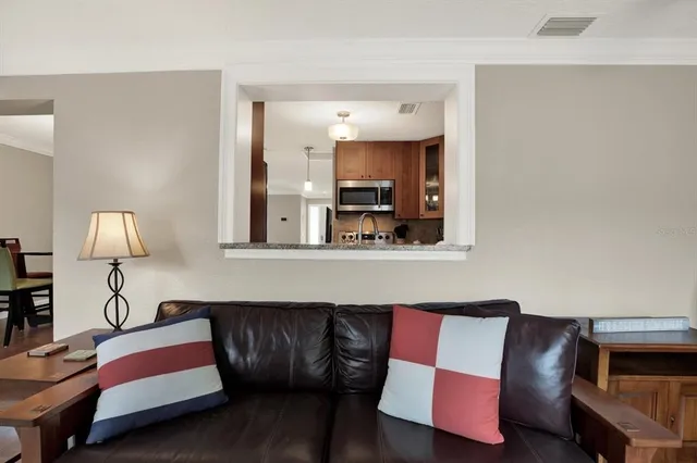 a living room with furniture and a lamp