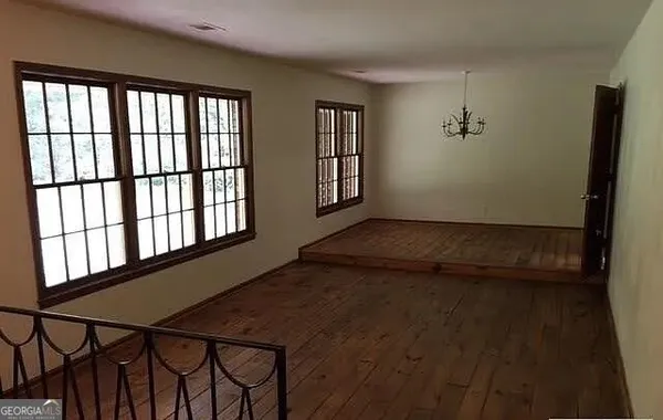 a view of an empty room with windows
