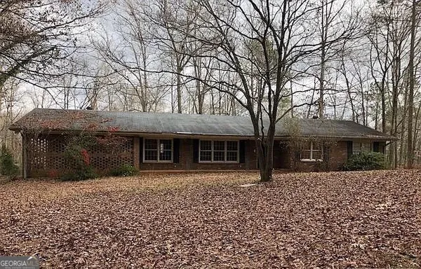 front view of house with a trees