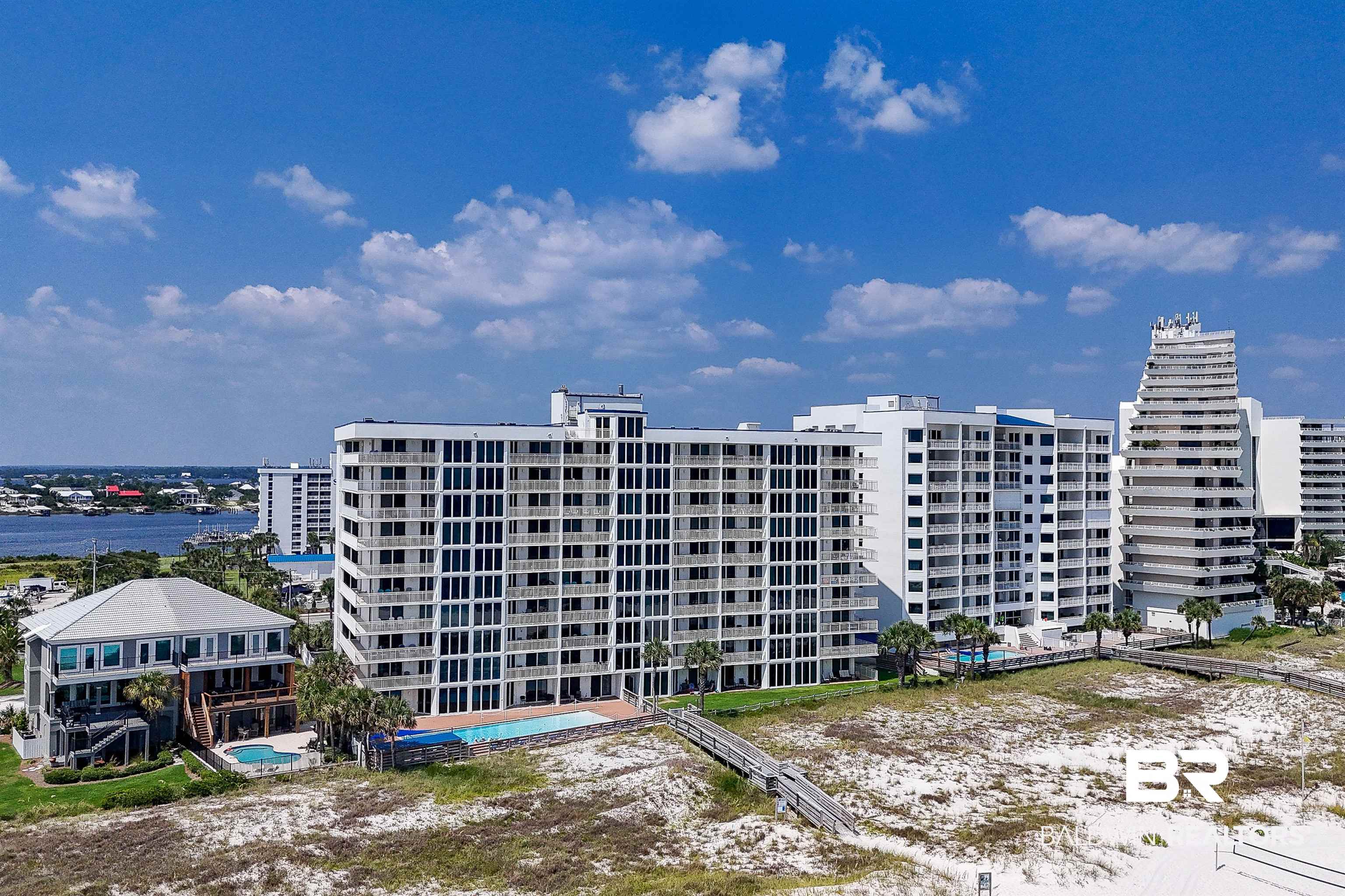 16287 Perdido Key Drive, Unit 105 Pensacola, FL 32507 - Photo 6 of 66 Multi-story residential buildings with balconies, situated near a sandy beach