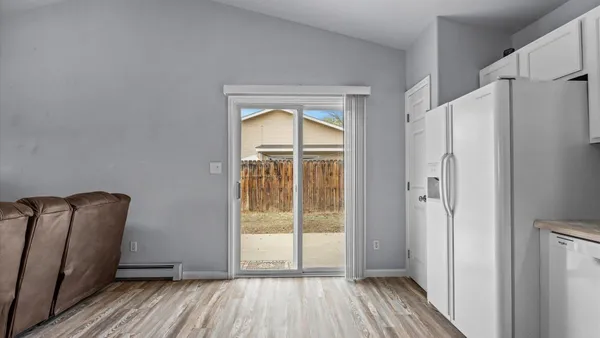 a view of front door with wooden floor