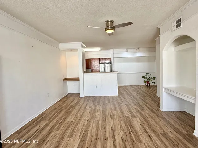 a front view of a building with a yard