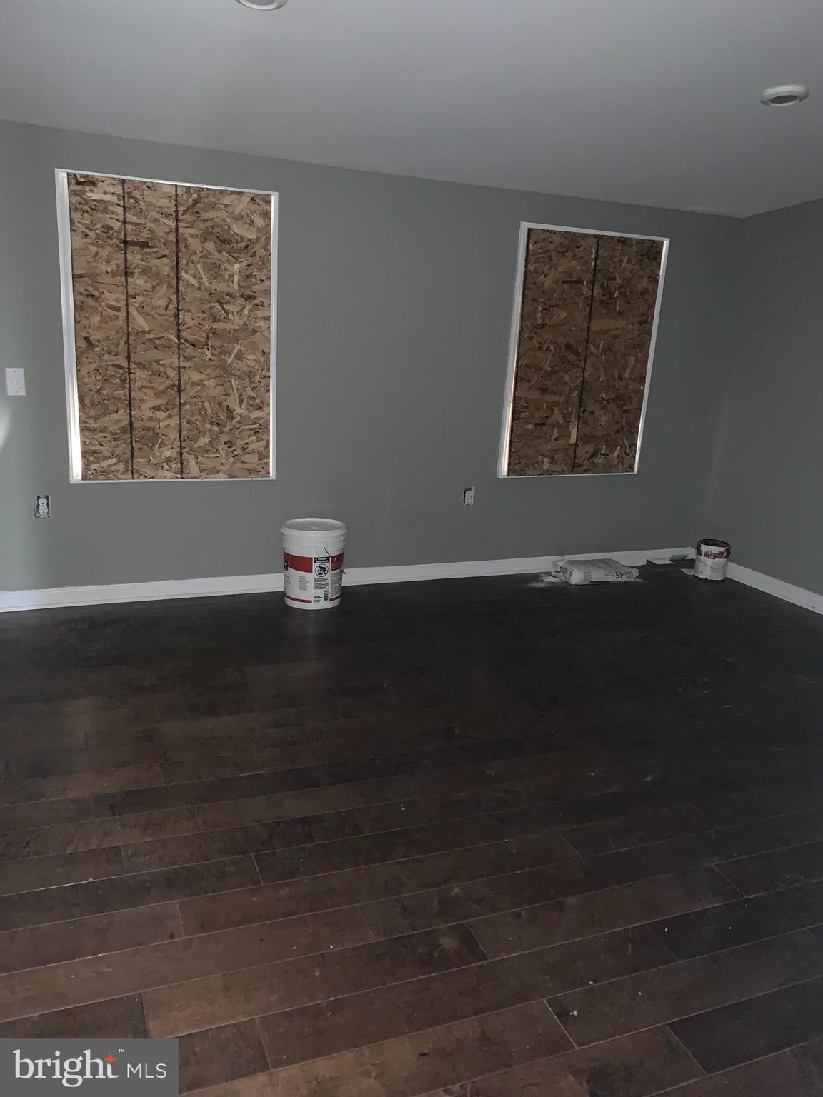 943 North Mount Street Baltimore, MD 21217 - Photo 5 of 11 an empty room with wooden floor and a window