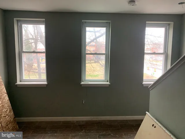 a view of a room that has a window in it
