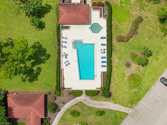 a aerial view of a house with yard patio and outdoor seating