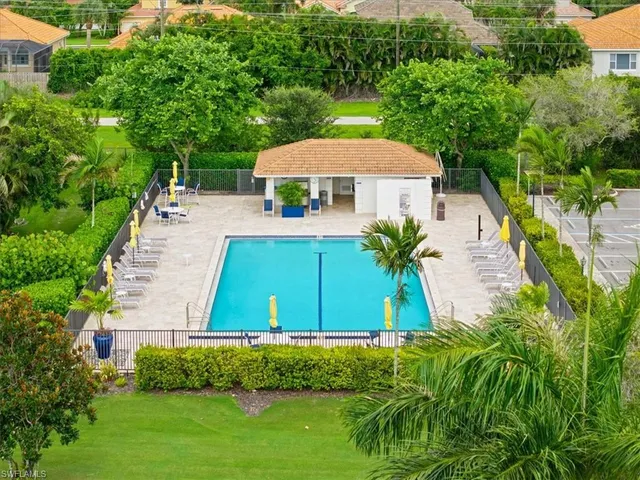 an aerial view of a house with a garden and trees
