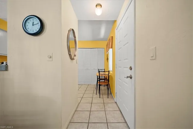 a view of a bathroom with a shower and mirror