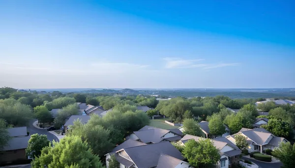 an aerial view of a house with outdoor space