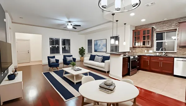 a living room with stainless steel appliances kitchen island granite countertop furniture and a kitchen view