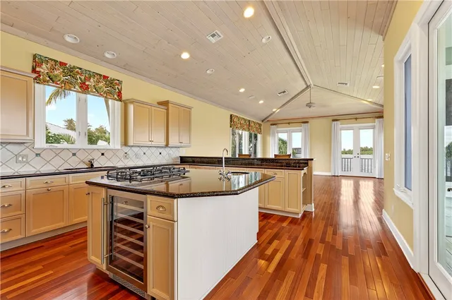 a view of an entryway with wooden floor and door