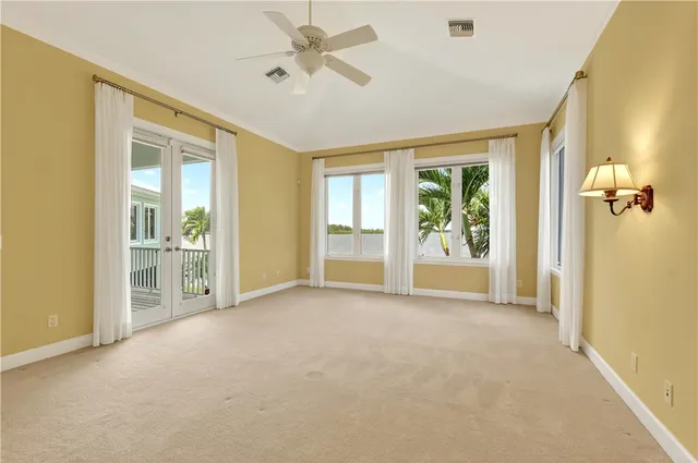 a spacious bathroom with a tub sink and mirror