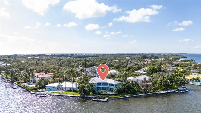a view of a swimming pool with an outdoor seating space
