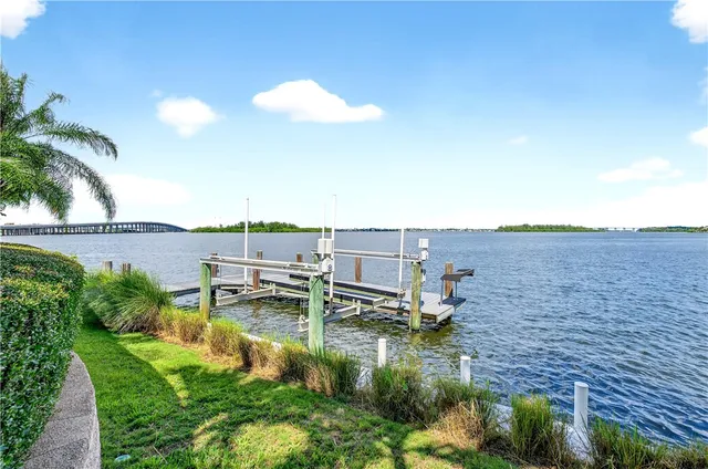 a front view of a house with a yard and a garden