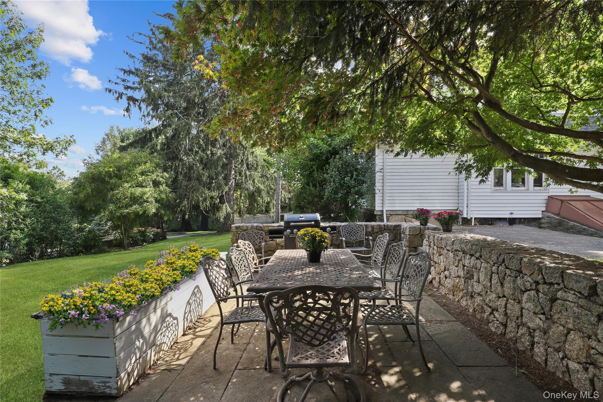 16 Annadale Street Armonk, NY 10504 - Photo 14 of 19 a view of backyard with seating area and green space